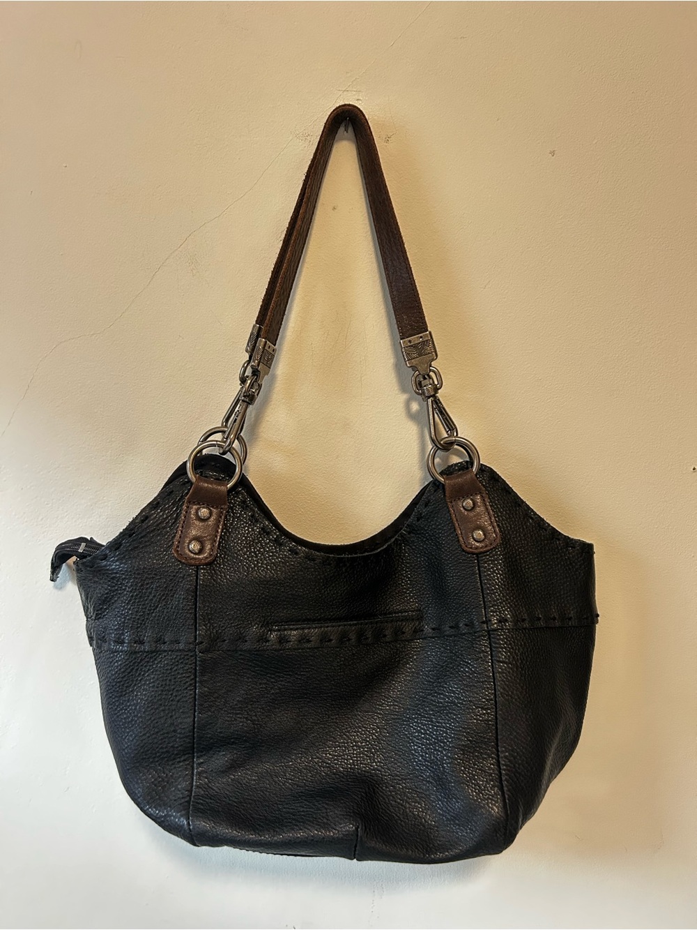 The Sak Black Leather Shoulder Bag with Brown Strap Accents